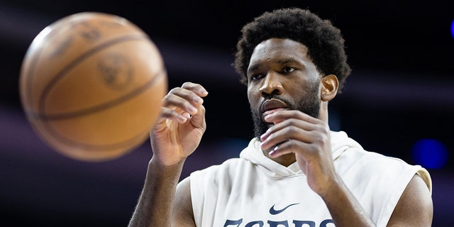Joel Embiid warms up