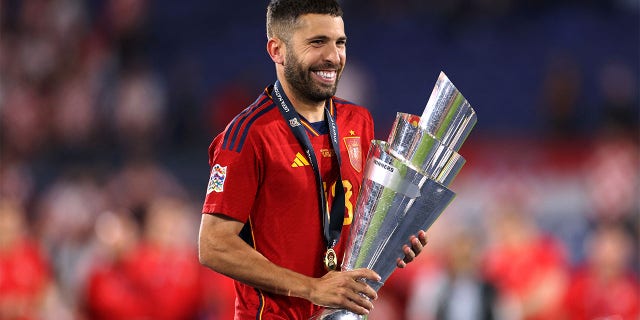 Jordi Alba holds UEFA Nations League Trophy