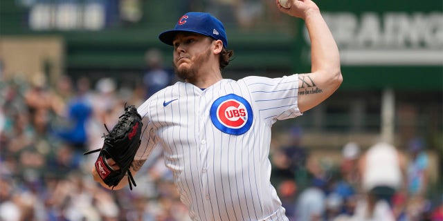 Justin Steele throws pitch