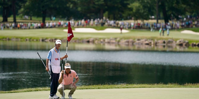 Bernhard Langer lines up putt