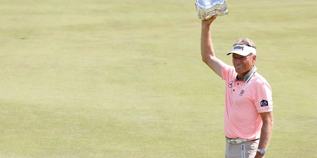 Bernhard Langer poses with trophy