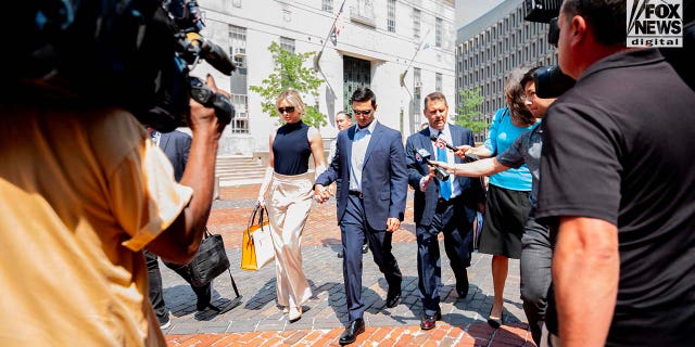 Accused rapist Matthew Nilo and fiancee, Laura Griffin walk together