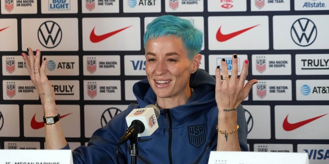 Megan Rapinoe talks to the media
