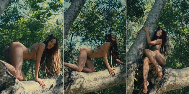 Megan Fox posing in a bikini in a tree