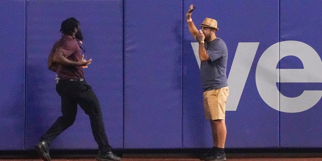 Fan surrenders to security