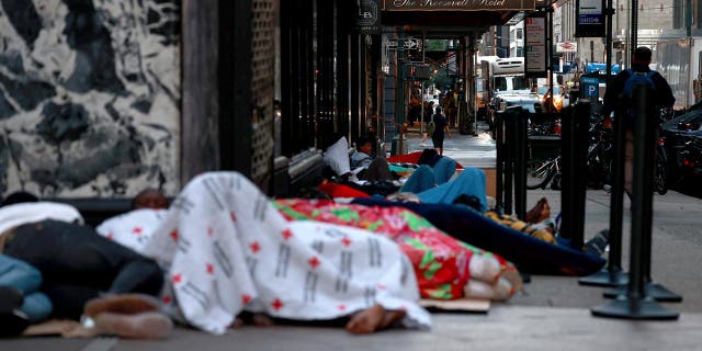 Migrants sleep on the street in New York City