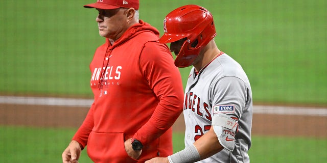 Mike Trout walks with Phil Nevin