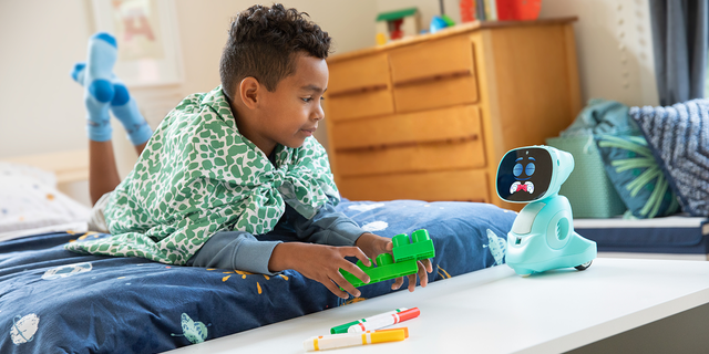 Miko playing legos with a boy