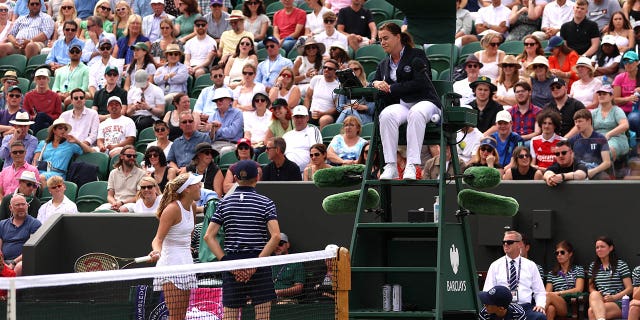 Mirra Andreeva talks with the umpire during her fourth round match at Wimbledon