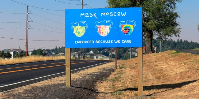 A 'mask moscow' sign along road in Moscow, Idaho