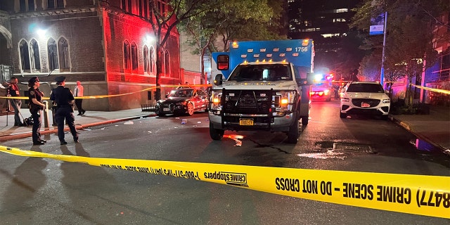 Ambulance parked behind crime scene tape
