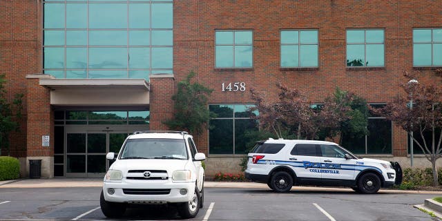 Police car outside the office where doctor was murdered