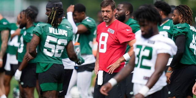 Aaron Rodgers participates in a drill during a Jets practice