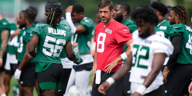 Aaron Rodgers participates in a drill during a Jets practice