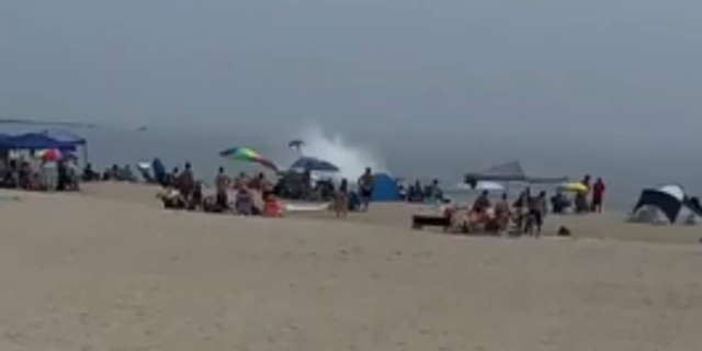 Tail of plane crashing into water