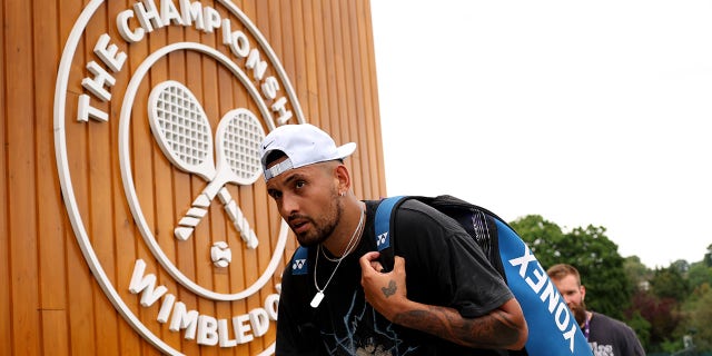 Nick Kyrgios walks into Wimbledon