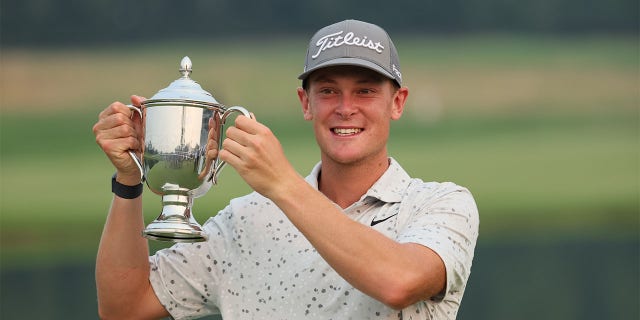 Vincent Normann holds the trophy
