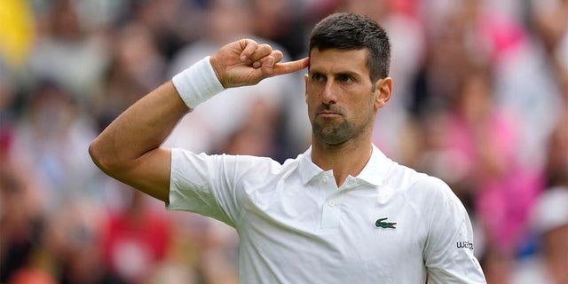 Novak Djokovic celebrates winning set