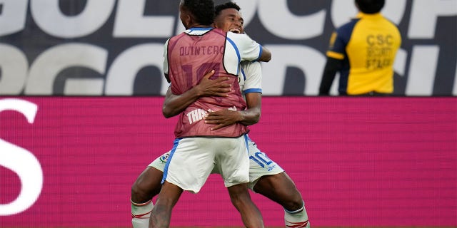 Yoel Bárecenas celebrates with teammate