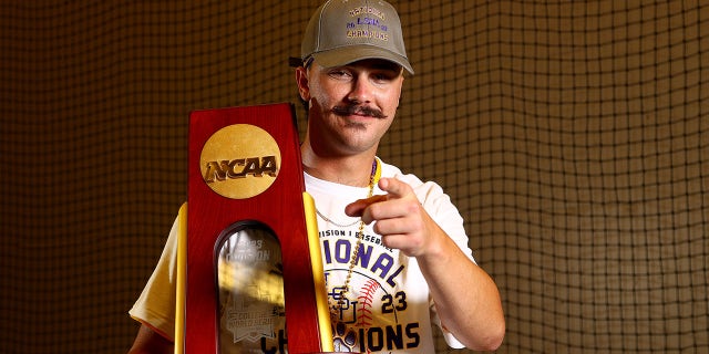 Paul Skenes with the trophy