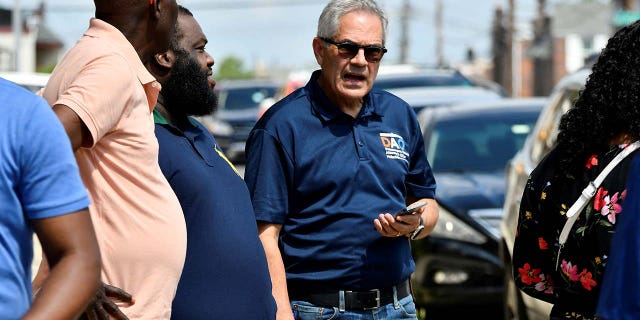 District Attorney Larry Krasner listens to community members