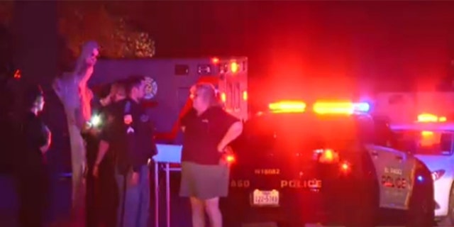Police talking outside after a house party shooting in El Paso, Texas