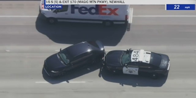 Police stop homeless man driving stolen black Toyota camry on highway next to a FedEx truck