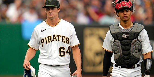 Quinn Priester and Endy Rodriguez walk