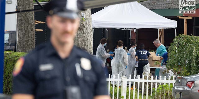 Authorities carry items out of Rex Heuermann's home in Massapequa Park