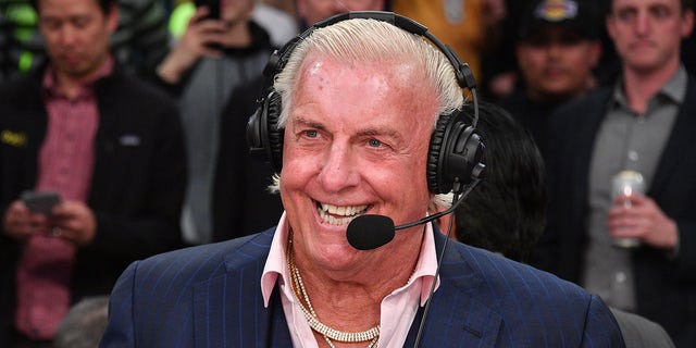 Ric Flair smiles with headset on