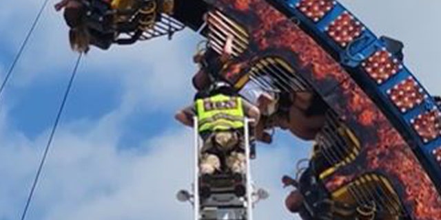 Firefighter helping stuck riders