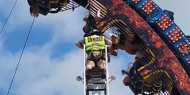Firefighter helping stuck riders