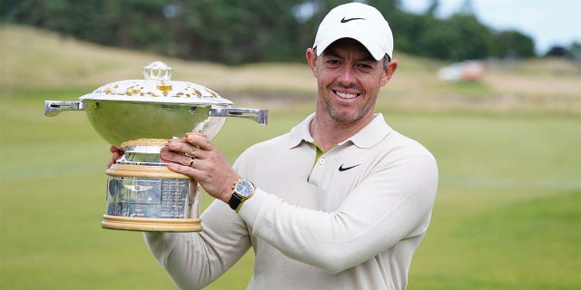 Rory McIlroy lifts trophy
