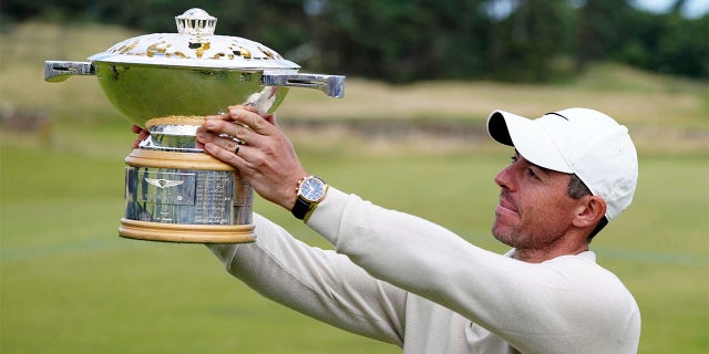 Rory McIlroy lifts trophy