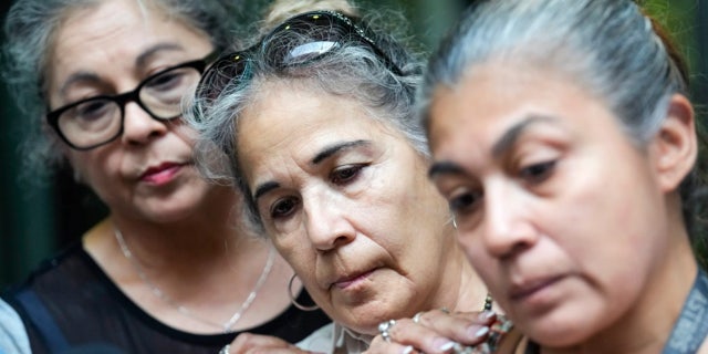 three women at press conference