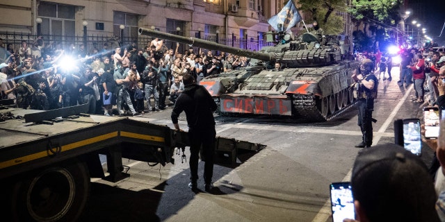 Members of Wagner group prepare to pull out from the headquarters of the Southern Military District