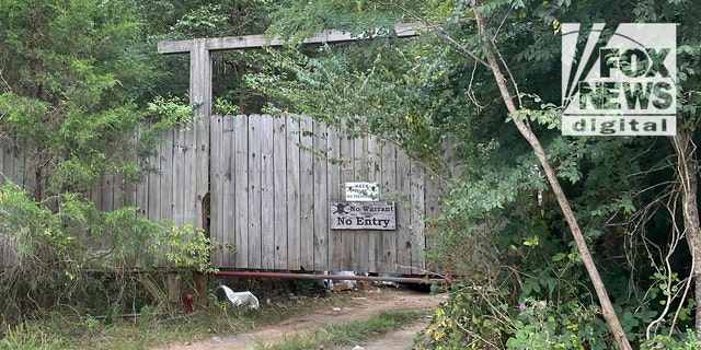 Craig Heuermann's front gate with two 'no trespassing' signs