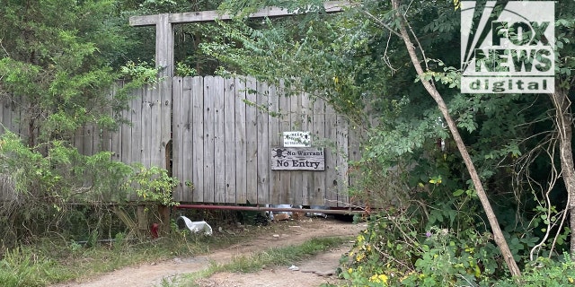 Craig Heuermann's front gate with two 'no trespassing' signs