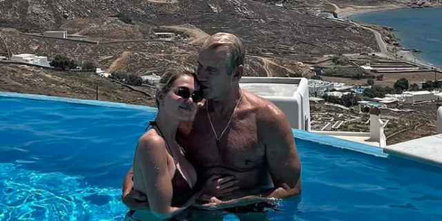 Dolph Lundgren and Emma in a pool