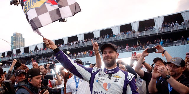 Shane Van Gisbergen waves the flag