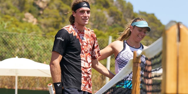 Stefanos Tsitsipas reacts after a practice session