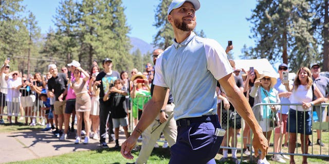 Steph Curry walks the court