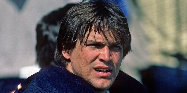 Steve McMichael sits on sideline