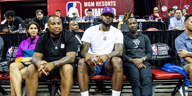 LeBron James and Rich Paul sit courtside 