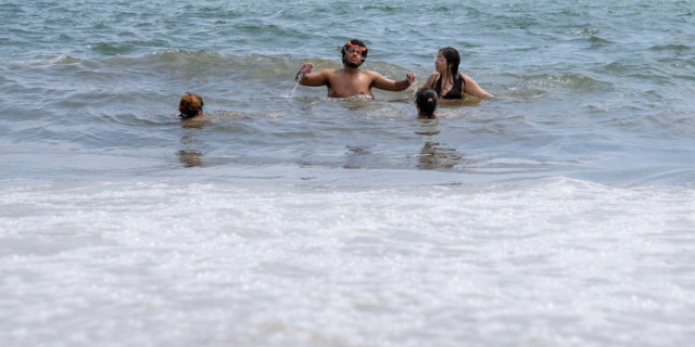 Swimmers in New York waters