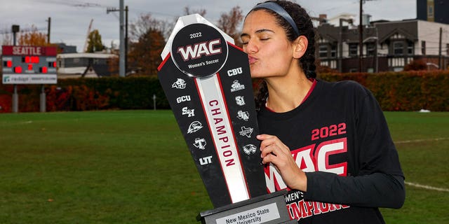 Thalia Chaverria holds the WAC trophy