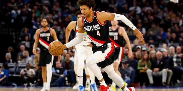 Matisse Thybulle dribbles