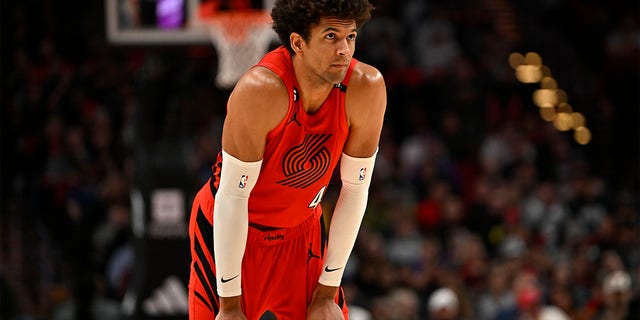 Matisse Thybulle looks on