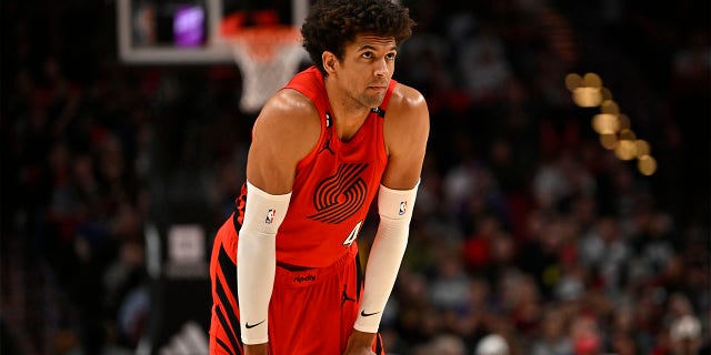 Matisse Thybulle looks on