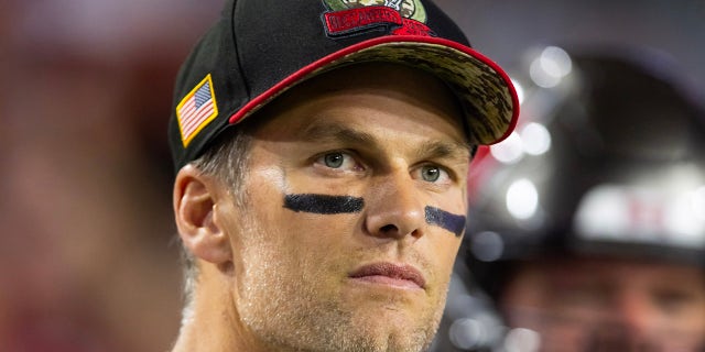Tom Brady looks on